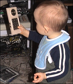 to soothe everyone's nerves, here's a cute picture of Evan playing with an Intellivision controller