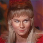 Grace Lee Whitney as Yeoman Janice Rand